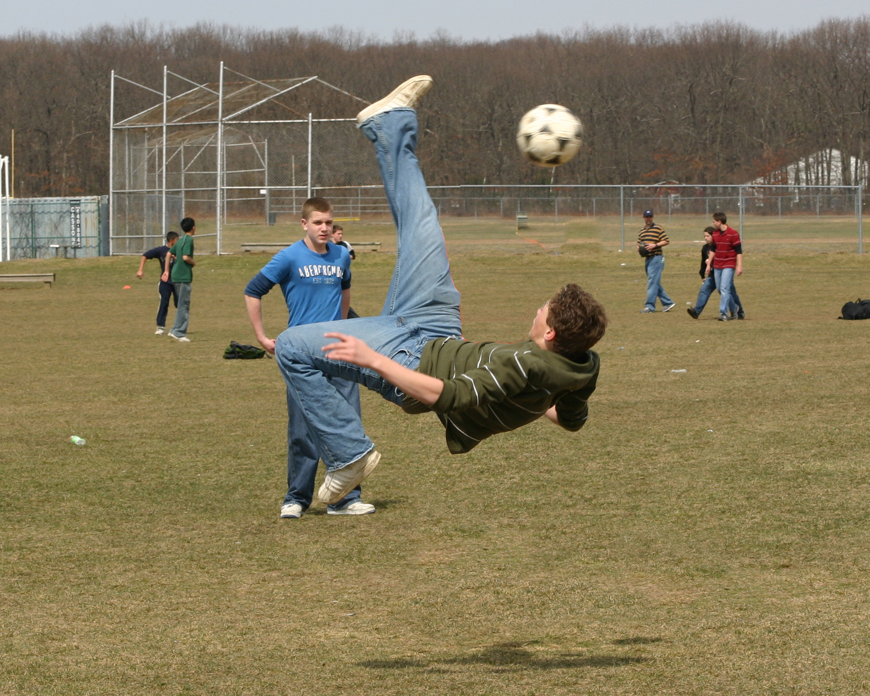a soccer bicycle kick edited to remove a boy from the picture